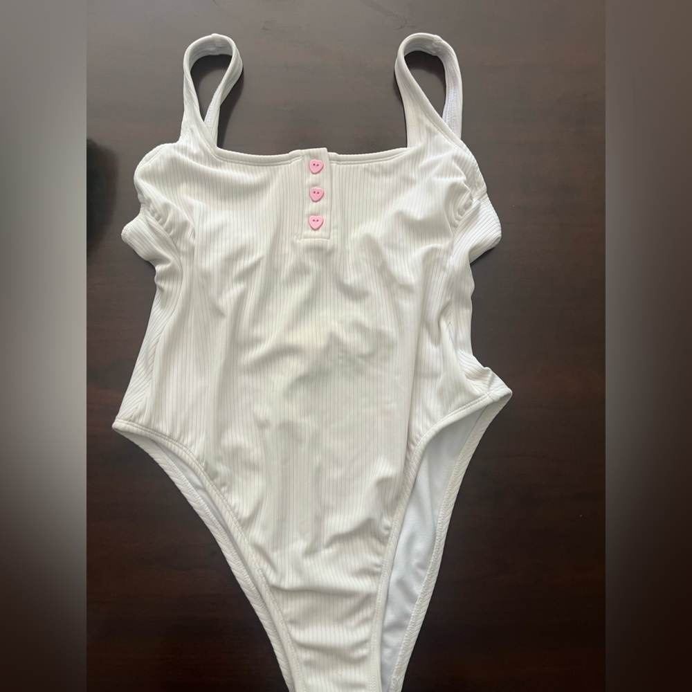 Brand new bathing suit still with liner, size small white.